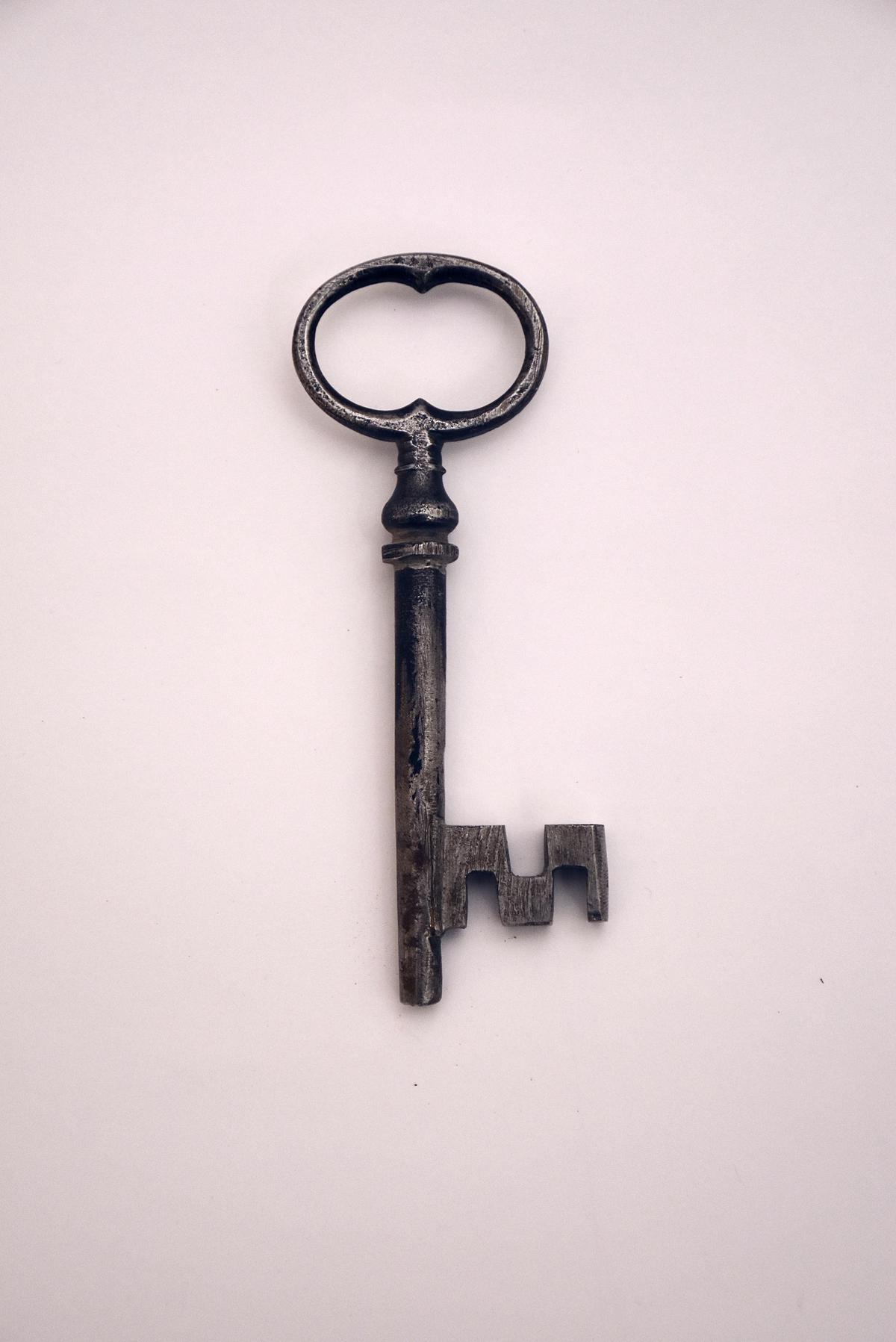 Illustration of a person facing a key and lock, symbolizing access key issues and troubleshooting.